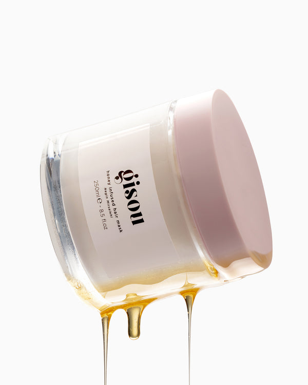 Honey Infused Hair Mask suspended on air with honey dripping from the side